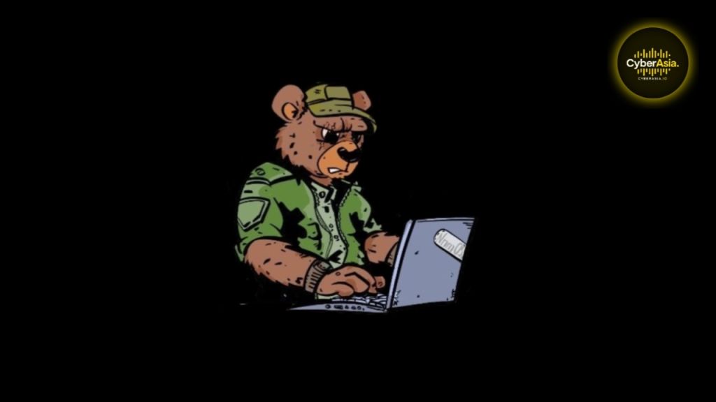 Figure 2 : Cartoon bear in a green military cap typing on a laptop, an illustration used by CyberAsia.io for the NoName057(16) DDoS group